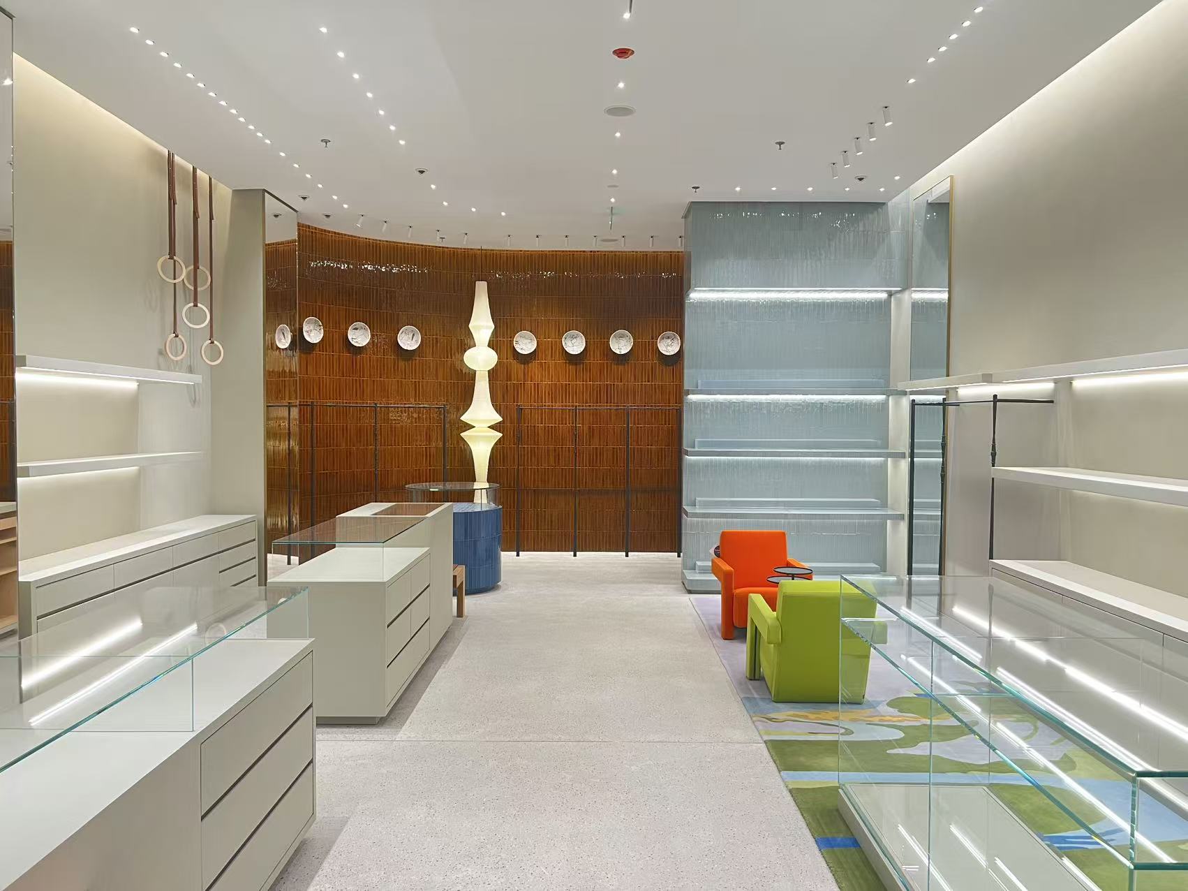 Modern concept boutique interior with ceramic sculpture and lounge seating